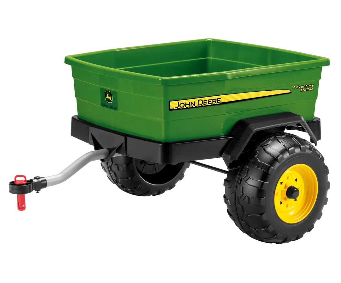 A green and black John Deere plastic toy wagon with yellow wheels, a silver hitch, and a red handle, shown on a white background.