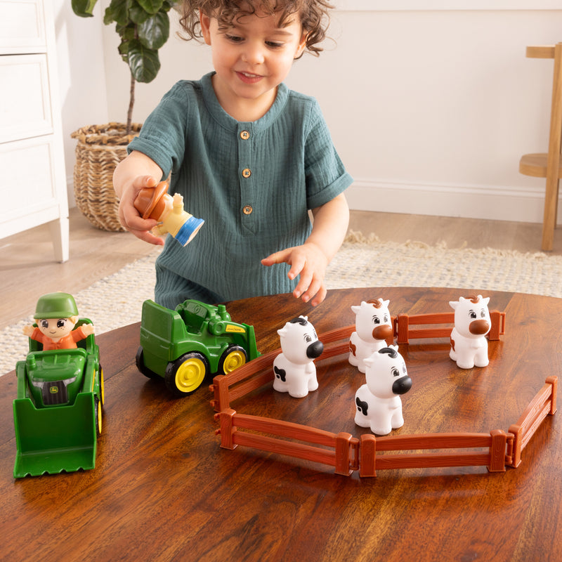 Boy Playing with a John Deere The Cows Are Out Playset 