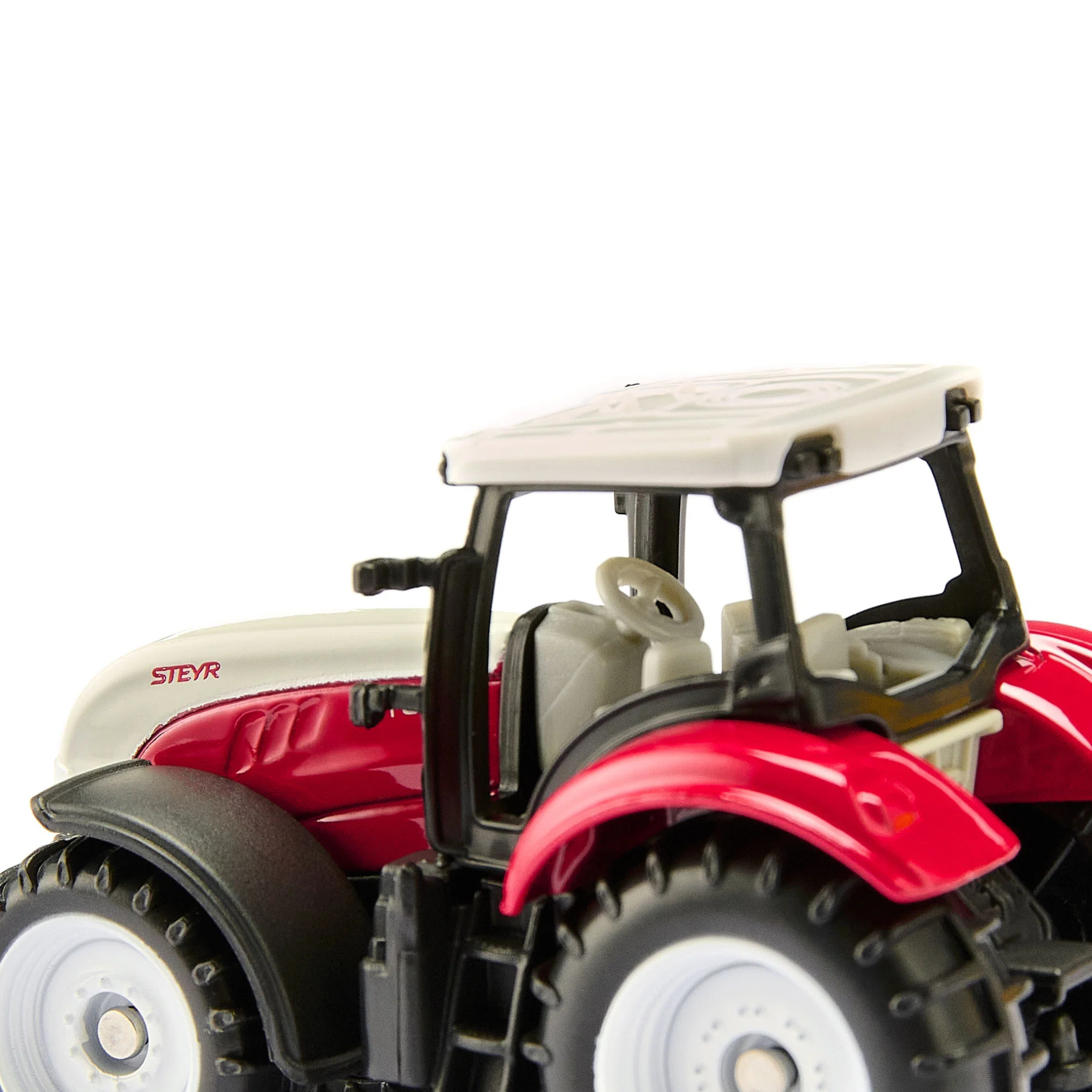 Siku Mini Steyr toy tractor inside cab